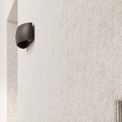 Applique murale Coquille en céramique noire, éclairage haut et bas